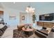 Cozy living room featuring stylish decor, comfortable seating, and plenty of natural light at 974 W Saddle Run, Apache Junction, AZ 85120