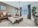 Serene main bedroom with textured accent wall, modern furnishings, and soft carpeting at 974 W Saddle Run, Apache Junction, AZ 85120