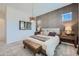 Bright main bedroom featuring a textured accent wall, coordinated decor, and a comfortable layout at 974 W Saddle Run, Apache Junction, AZ 85120