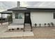 Charming front door with modern railings and beautiful landscaping enhance the entrance of this home at 9810 N 2Nd Way, Phoenix, AZ 85020