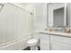 Well-lit bathroom featuring a shower-tub combination and a vanity with granite countertops at 9823 E Red Giant Dr, Mesa, AZ 85212