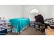 Functional bedroom featuring a bed and workspace, maximizing space and productivity at 9823 E Red Giant Dr, Mesa, AZ 85212