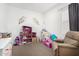 Bright bedroom with dollhouse and toys, perfect for a play and imagination at 9823 E Red Giant Dr, Mesa, AZ 85212