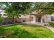 The home has a backyard and covered patio perfect for entertaining at 11023 E Florian Ave, Mesa, AZ 85208