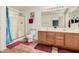 Bright bathroom featuring a glass-enclosed shower, double sink vanity, and wood-style flooring at 11023 E Florian Ave, Mesa, AZ 85208