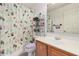 This bathroom features a single sink and a cactus-themed shower curtain at 11023 E Florian Ave, Mesa, AZ 85208