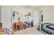Bedroom featuring two twin beds, a desk, and an open doorway at 11023 E Florian Ave, Mesa, AZ 85208
