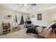 Comfortable bedroom with a ceiling fan, natural light, and cozy decor at 11023 E Florian Ave, Mesa, AZ 85208