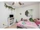 Well-lit bedroom featuring an accent window, neutral walls, and a ceiling fan at 11023 E Florian Ave, Mesa, AZ 85208