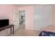 Bedroom with a pink wall, large closet, and a nice view into the hallway at 11023 E Florian Ave, Mesa, AZ 85208