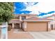 Inviting two-story home featuring a well-maintained front yard and an attached two-car garage at 11023 E Florian Ave, Mesa, AZ 85208