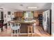 Spacious kitchen featuring a large island, stainless steel appliances, and ample cabinet space at 11023 E Florian Ave, Mesa, AZ 85208