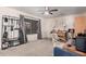Cozy room featuring carpet, window, ceiling fan, and piano at 11023 E Florian Ave, Mesa, AZ 85208