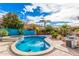 The backyard oasis has a pool, spa, and beautiful desert landscaping at 11023 E Florian Ave, Mesa, AZ 85208