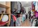 Spacious walk-in closet with ample shelving and hanging storage for clothes and accessories at 11023 E Florian Ave, Mesa, AZ 85208
