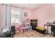 Bedroom with a closet, a playset, large window and tile flooring at 11813 W Sierra St, El Mirage, AZ 85335
