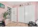 Bedroom with a closet, wall decorations, and tiled flooring at 11813 W Sierra St, El Mirage, AZ 85335