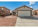 Charming home featuring a well-maintained front yard and a convenient two-car garage at 11813 W Sierra St, El Mirage, AZ 85335