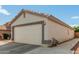 Home with a spacious two-car garage and well-maintained exterior at 11813 W Sierra St, El Mirage, AZ 85335
