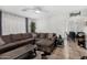 Spacious living room with tile floors, neutral walls, and seamless flow to other rooms at 11813 W Sierra St, El Mirage, AZ 85335