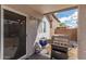 Covered patio with bbq grill for outdoor cooking and entertaining, accessible from a sliding glass door at 11813 W Sierra St, El Mirage, AZ 85335
