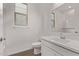 Bathroom featuring single sink vanity, white cabinets, and a toilet at 12378 W Marguerite Ave, Avondale, AZ 85323