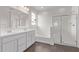 Bathroom featuring double sink vanity, soaking tub and glass shower at 12378 W Marguerite Ave, Avondale, AZ 85323