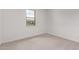 Bedroom featuring a carpeted floor and a window at 12378 W Marguerite Ave, Avondale, AZ 85323