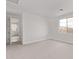 Spacious bedroom with a large window and soft carpet, providing a comfortable and serene atmosphere at 12378 W Marguerite Ave, Avondale, AZ 85323