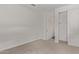 Cozy bedroom featuring neutral carpet, a closet, and white walls for a clean aesthetic at 12378 W Marguerite Ave, Avondale, AZ 85323