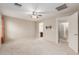 A large bedroom with neutral walls, carpet, ceiling fan and natural light at 1265 S Aaron -- # 355, Mesa, AZ 85209