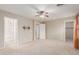 An open bedroom featuring plush carpet, a ceiling fan, and multiple entry points at 1265 S Aaron -- # 355, Mesa, AZ 85209