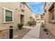 Neutral stucco townhome with desert landscaping and sidewalks at 1265 S Aaron -- # 355, Mesa, AZ 85209