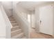 Foyer with staircase, beige carpet, tile flooring, and closet at 1265 S Aaron -- # 355, Mesa, AZ 85209