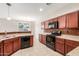 Spacious kitchen with stainless steel appliances, tile floors, and plenty of counter space at 1265 S Aaron -- # 355, Mesa, AZ 85209