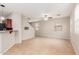 Open-concept living room and kitchen with tile floors and a ceiling fan at 1265 S Aaron -- # 355, Mesa, AZ 85209