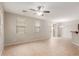 Living room with tile floors, ceiling fan, and sliding door to patio at 1265 S Aaron -- # 355, Mesa, AZ 85209