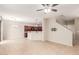 Open-concept living room and kitchen with tile floors and a ceiling fan at 1265 S Aaron -- # 355, Mesa, AZ 85209