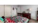 Bedroom featuring wood floors, closet and natural light, creating a welcoming space at 1312 N Joplin Cir, Mesa, AZ 85207