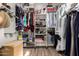 Spacious walk-in closet with ample shelving and hanging space for organization and storage at 1312 N Joplin Cir, Mesa, AZ 85207