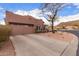 Single level home with two-car garage and desert landscaping in a suburban neighborhood at 1312 N Joplin Cir, Mesa, AZ 85207