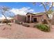 Single level home with gated front patio, desert landscaping and walkway at 1312 N Joplin Cir, Mesa, AZ 85207