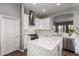 Bright, modern kitchen with stainless steel appliances, a center island, and an open layout at 1312 N Joplin Cir, Mesa, AZ 85207
