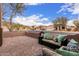 Gated patio area with comfortable furniture and colorful pillows for outdoor relaxation at 1312 N Joplin Cir, Mesa, AZ 85207