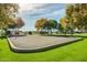 Outdoor volleyball court surrounded by lush greenery, providing a recreational amenity for residents to enjoy at 1312 N Joplin Cir, Mesa, AZ 85207