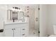 Stylish bathroom featuring modern vanity, sink, and glass-enclosed shower at 1337 E Halifax St, Mesa, AZ 85203