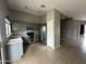 Functional kitchen with stainless steel appliances, ample cabinet space, and easy access to the adjacent dining area at 15023 W Caribbean Ln, Surprise, AZ 85379