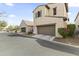 Exterior showcasing a two-story home with a two-car garage and a detached one-car garage at 15469 W Dreyfus St, Surprise, AZ 85379