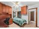 Bedroom with built-in desk and cabinets, a ceiling fan, and natural light at 16923 E Last Trail Dr, Fountain Hills, AZ 85268