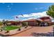 Single story home with desert landscaping, covered parking, and brick driveway on a sunny day at 16923 E Last Trail Dr, Fountain Hills, AZ 85268